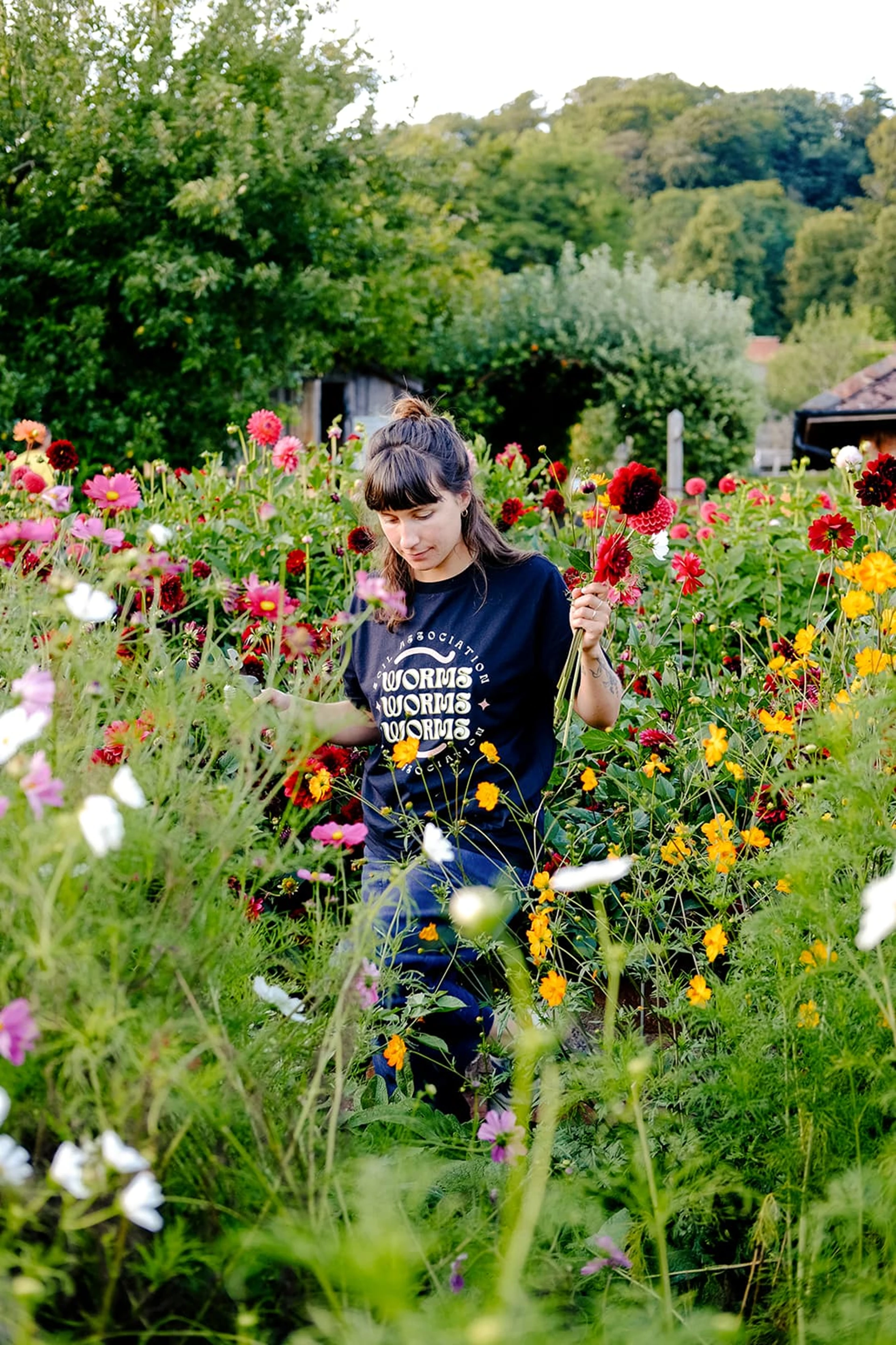 woman_in_soil_association_t-shirt_in_plants